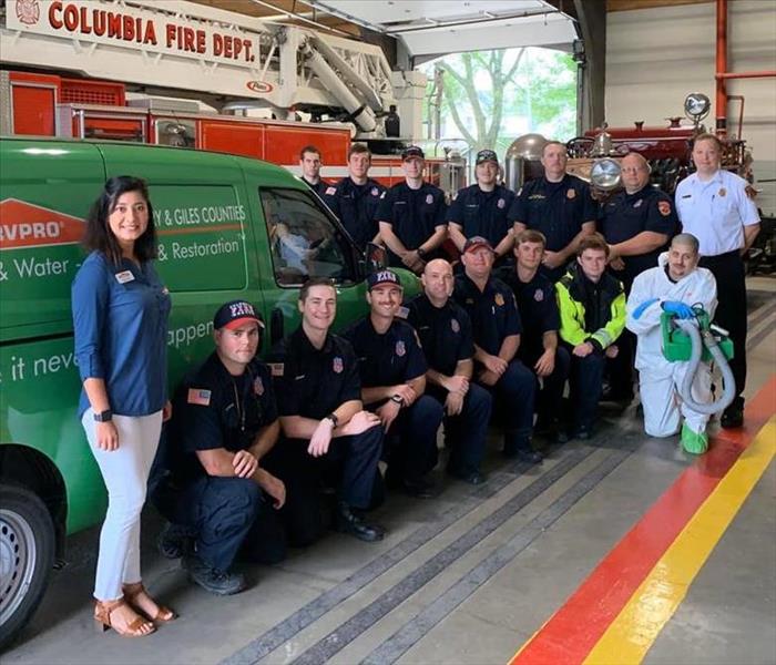 SERVPRO posing with the firemen after the cleaning